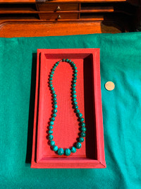 Malachite Necklace, 23” long, weighs 146 grams.