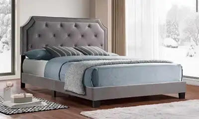 Elevate your bedroom with this elegant queen-size upholstered bed frame, featuring a button-tufted h...