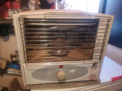 This is a Kero World kerosene heater, perfect for providing supplemental heat in a workshop or garag...