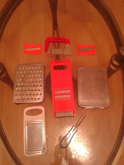 A Set of 8 Stainless Steel Shredders / Peelers / Graters, New., View more