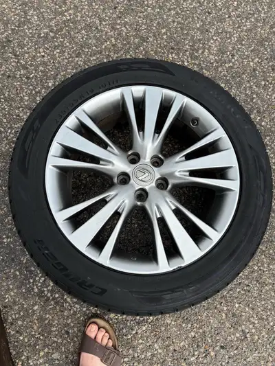 4 tires with great tread life on Lexus rims. 5 spoke. 3 tires are Kumho Crugen Premium and one is An...