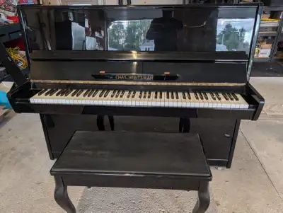 FREE!!! This Chas. Heintzman upright piano is a pre-owned instrument featuring a classic black high-...