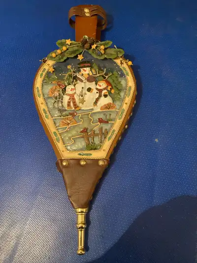 Unique vintage bellows. Features a charming winter scene with snowmen. Leather and metal constructio...