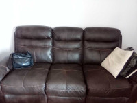 Brown leather couch, loveseat, and chair all recline 