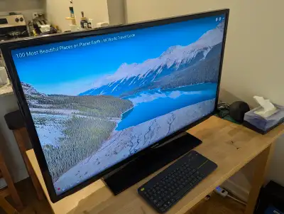 Samsung 40 inch LED TV with universal remote, View more
