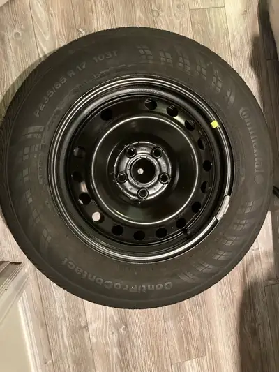 This Continental ContiProContact tire and a generic black steel rim were purchased several years ago...