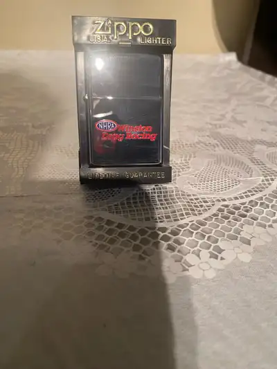 I'm offering a brand new, sealed Zippo Winston NHRA Drag Racing polished chrome lighter, still seale...