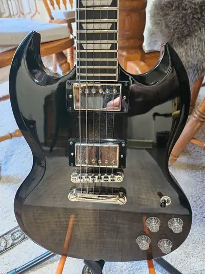 MINT. Perfect Condition Hard Shell SG Case included. The SG Modern Figured from Epiphone's Inspired...