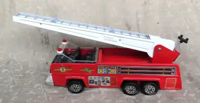 For sale vintage Tonka fire truck toy (1970, made in USA). Bright red pressed steel. About 26" (w) b...
