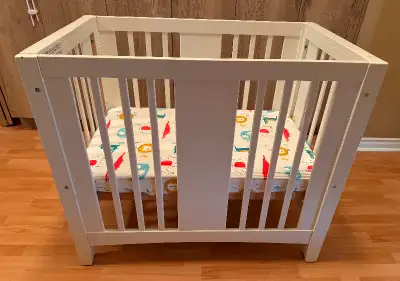 Off-white mini crib in good condition, minor scratches. L-42”, W-26”, H-36” Can be disassembled and...