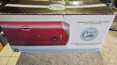 New Cricut Cake, comes with the 'Cake Basics' cartridge, a food safe cutting mat, and a booklet. can...