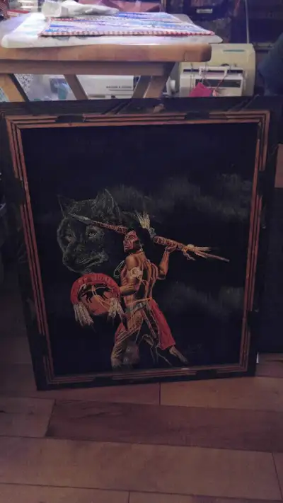 Black velvet art featuring a Indian and a wolf., View more