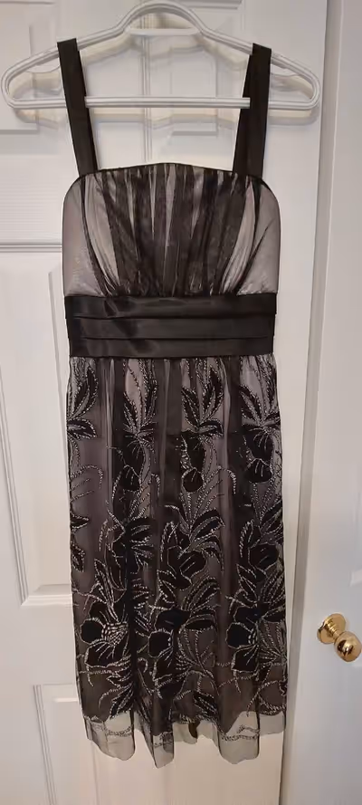 Fancy dress. Size 8. Black tule overlayed over silver satin, silver embellishment. Brand: R&M Richar...