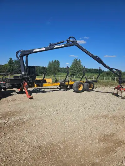 Skid steer mount log trailer, heavy duty tandem axles with flotation tires. It is set up to run with...
