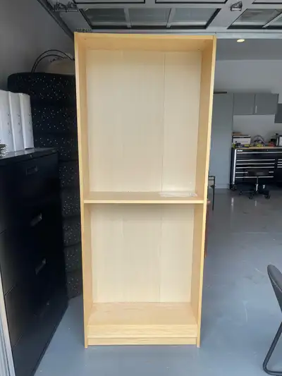 Maple colored IKEA bookcase. Comes with the shelves and pins for placement.