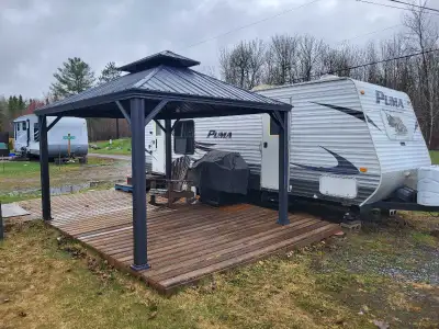 $5000 Trailer and stuff plus $3000 seasonal campsite. 2010 Puma 25ft Travel Trailer with 8ft pull ou...