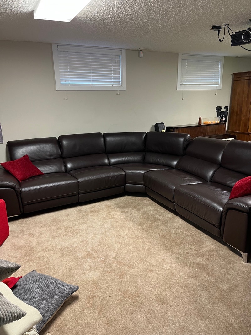 Large, beautiful, brown leather sectional (motorized leg rests