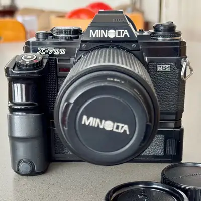 Minolta X-700 Film Camera, w/ motor drive Excellent cosmetic and functional condition. Shutter speed...
