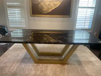 Granite table with gold accent legs Custom made for $5000 Black with gold veins. Gorgeous for any ho...