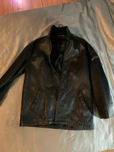 Here's a Danier black leather jacket in size S/P (Small/Petite), crafted from high-quality materials...