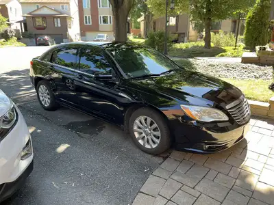 Selling a 2012 Chrysler 200 Touring that features all the options with a very upscale interior. Ligh...