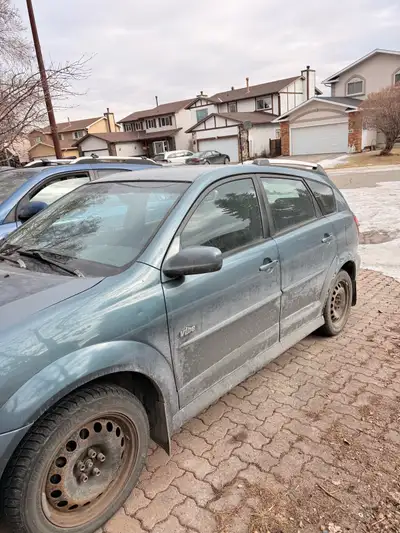 Blue/Grey2006 Pontiac Vibe Runs and drives well. Great commuter, first car