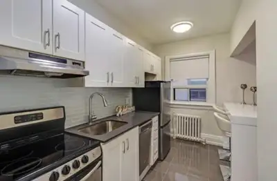 Photos included are similar to my unit. My unit has 2 larger windows, steel appliances, bright washr...