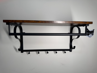 Move out sale — selling a floating wall-mounted coat rack with shelf. Rustic dark wood shelf with bl...