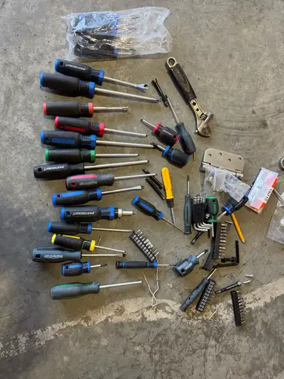 This is a used collection of mechanic's tools that includes a variety of wrenches, screwdrivers, and...