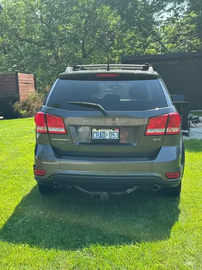 Dark grey 2015 Dodge Journey. Single owner. 232,000 km Muffler needs replaced. Rust spots, needs bra...