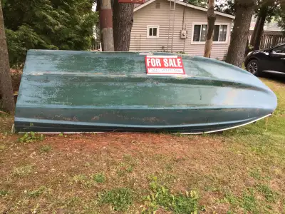 NEW PRICE. …..14 foot fibreglass boat. Solid. Three lift up seats with storage.