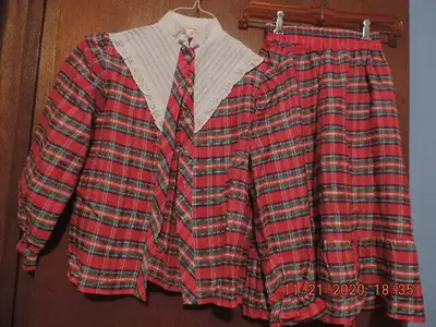 This pretty taffeta plaid skirt and blouse is in excellent condition with no rips or stains. From a...