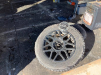 Bridgestone Blizzak winter tires on rims.