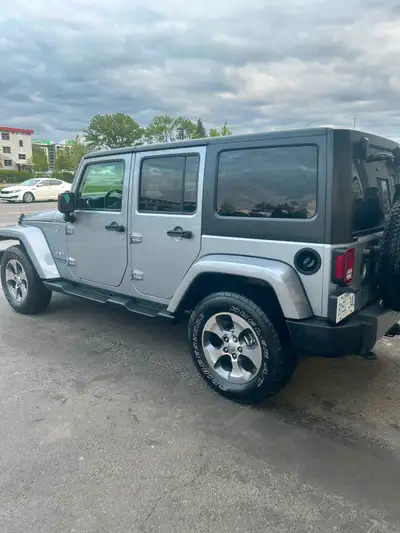 2016 Jeep Wrangler Unlimited Sahara with exceptionally low mileage—this 4-door SUV is in outstanding...