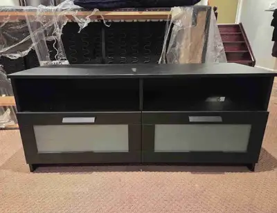 This is an IKEA TV stand that provides ample space for your media devices and accessories. This used...