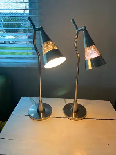 Add some wow to any room with this pair of silver modern table lamps. Height approx 21 1/2". Pick up...