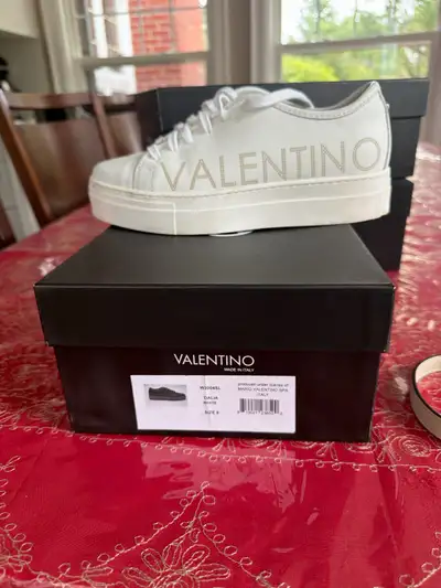 Elevate your footwear collection with these Valentino Dalia white leather sneakers, size 9, showcasi...