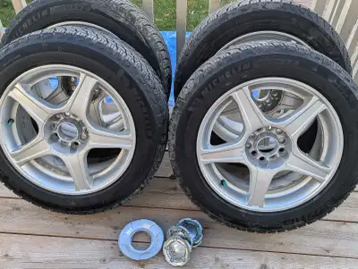 Set of 4 Michelin X Ice Snow Winter Tires on alloy rims. Tires are 8-9/32nds depth. Rims are multi f...