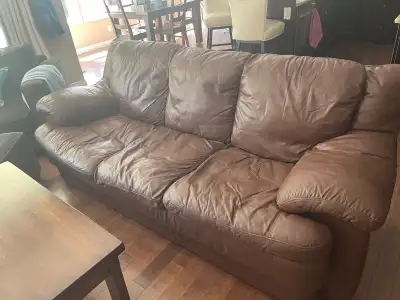 Brown leather couch and mini fridge - free to a good home. Must pick up in Cochrane. We have dogs so...
