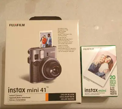Brand New in box. Fujifilm Instant camera . Comes with a box of 20 sheets of film . a stylish, retro...