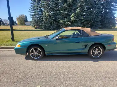 My Dad's 1996 Mustang convertible 3.8 V6 Auto, loaded, ONLY, 72,000. KM , its great on fuel. No rust...