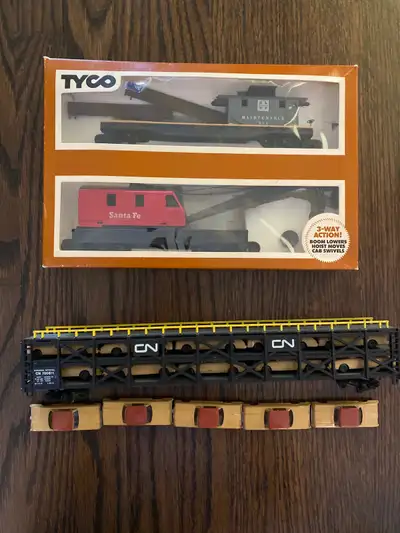 Bachmann tri-level rack car and Tyco crane car with boom tender, View more