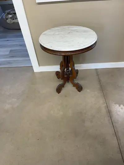 Antique table with marble top in great condition 902-394–0930