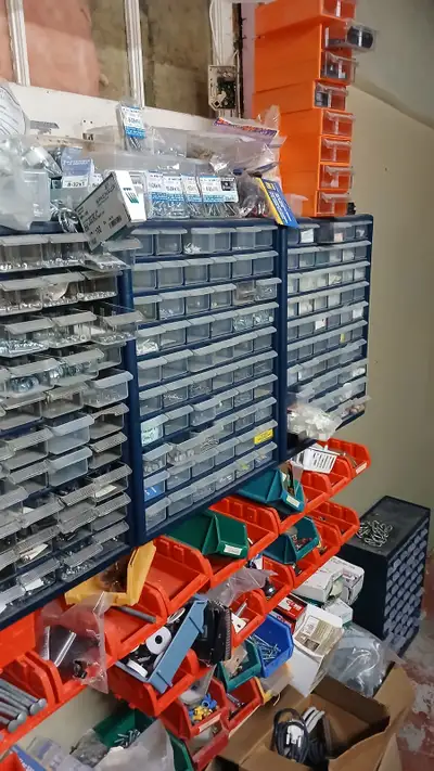 TOO MUCH TO MENTION: - 10 cabinet drawers - multi kinds of nuts, bolts, screws, staple nails, and mu...