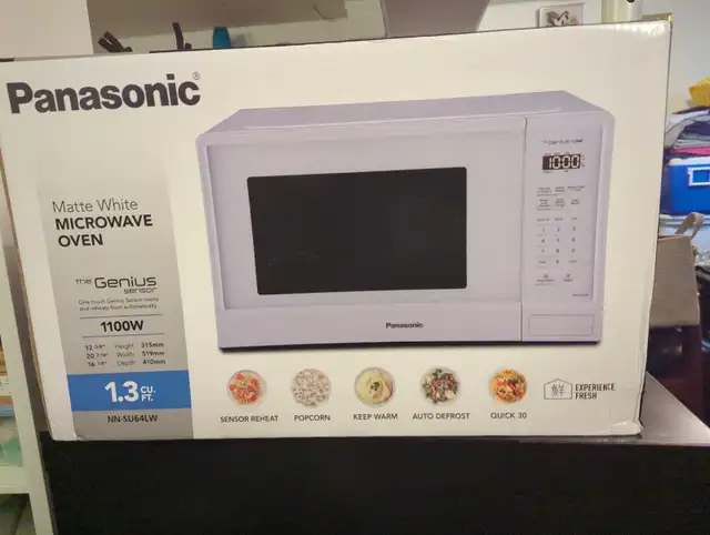 New unopened 1100w, 1.3 cu. ft. microwave 