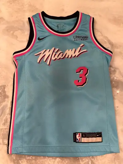 This is a Nike Miami Heat Dwyane Wade #3 jersey in a kids size small. It's in excellent condition an...