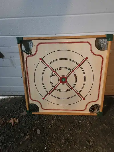 Not sure what all the games are. Looks like Checkers, chess and Crokinole. Hours of fun or frustrati...