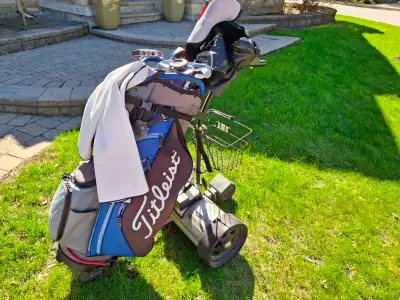 Electric golf bag caddy in good working condition. Battery, charger and some accessories included. E...