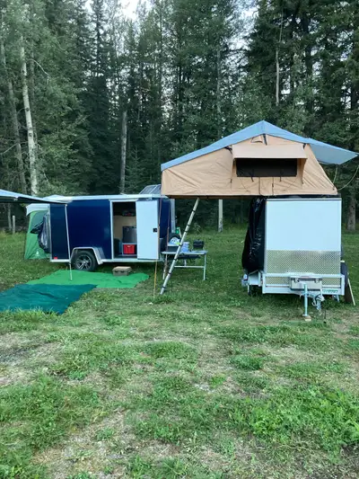 6’ x 8’ cargo trailer with roof top tent Cargo trailer has lights 20 gallon water tank with tap can...