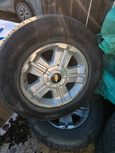 4 x 18" factory Chevy rims and center caps. tires no good they all leak an pretty much worn out.